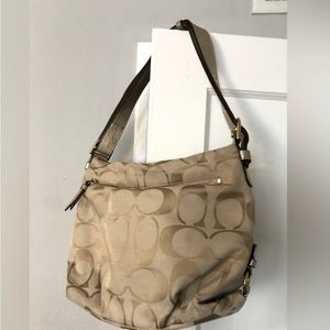 Coach tan handbag. Pink lining.